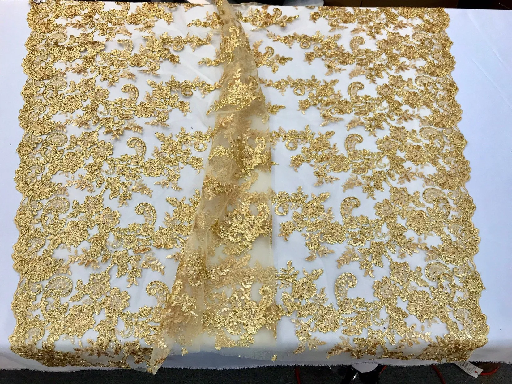 Metallic gold floral design embroidery on a mesh lace with sequins and cord-dresses-fashion-apparel-prom-nightgown-sold by the yard-