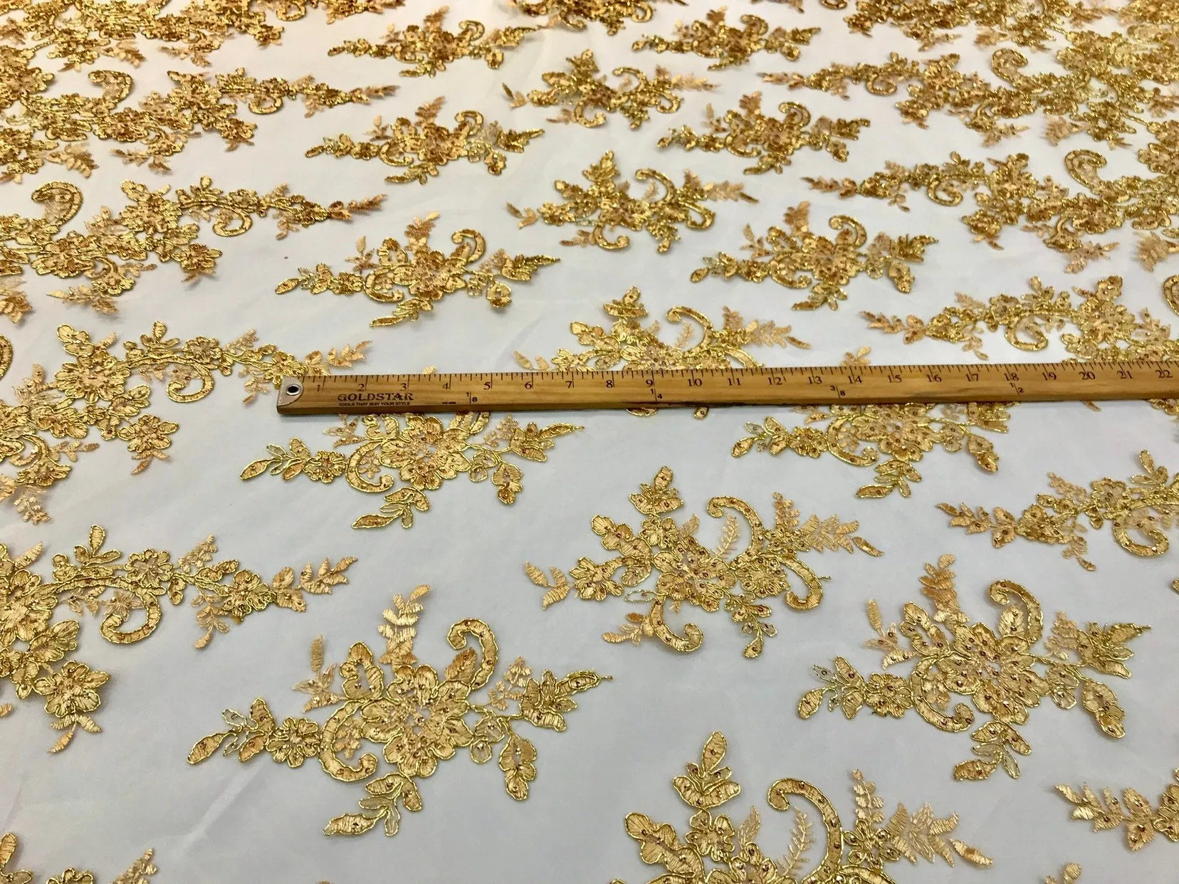 Metallic gold floral design embroidery on a mesh lace with sequins and cord-dresses-fashion-apparel-prom-nightgown-sold by the yard-